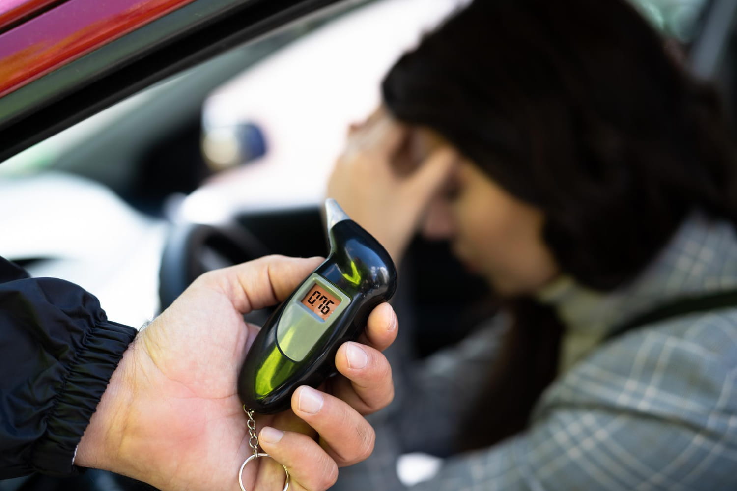breathalyzer device in hand