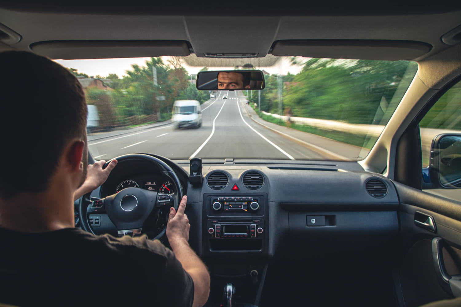 man driving a car at high speed